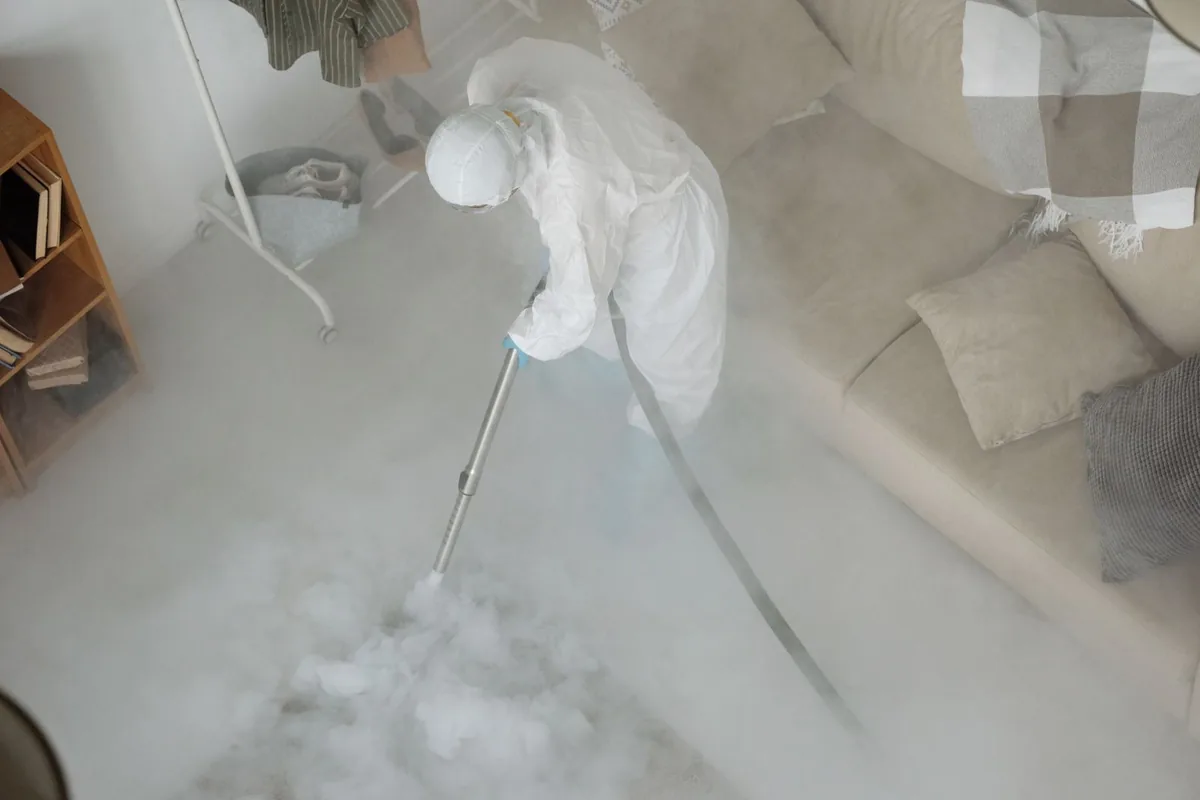 Biohazard cleanup technician in protective equipment, Oakwood, OH